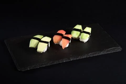 Vegetable sushi on flat slate Stock Photos