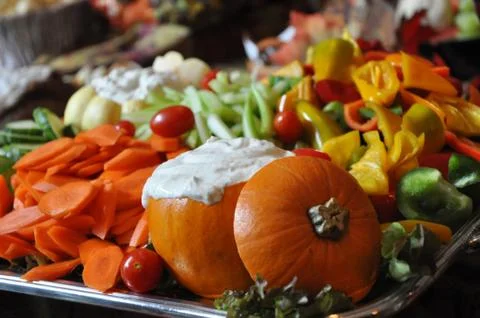 Vegetable tray with dip in pumpkin Stock Photos
