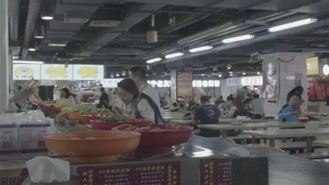 Vegetable Trays and Diners Inside Xidan Food Market Stock Footage 340467824