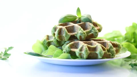 Vegetable waffles cooked with herbs in a plate  on white background Stock Footage 197045631
