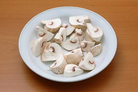 Vegetable, white button mushroom shape chopped mushroom in the plate Copyr... Stock Photos