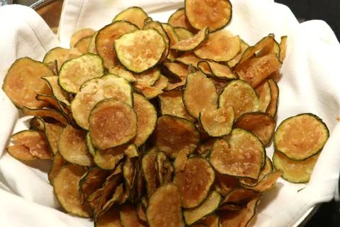 Vegetable zucchini chips in basket Stock Photos