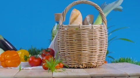 Vegetables and basket with bread in the fresh air Video stock 128180741