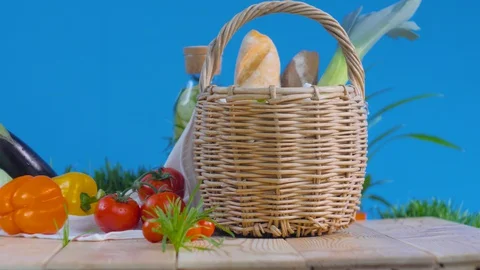 Vegetables and basket with bread in the fresh air Video stock 128181082