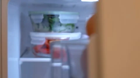Vegetables and berries in glass boxes in the refrigerator close-up. Stock Footage 255552127