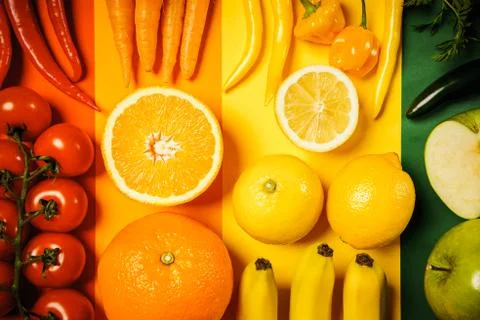 Vegetables and fruit on a colored background Stock Photos