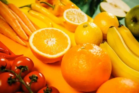 Vegetables and fruit on a colored background Stock Photos