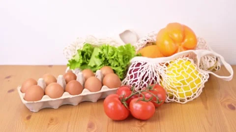 Vegetables and fruit in a string bag.Sustainable shoping Stock Footage 196882920