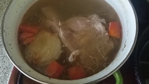 Vegetables and meat are cooked in a saucepan Stock Footage 242415455