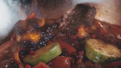 Vegetables and meat stew over an open fire Stock Footage 73215913