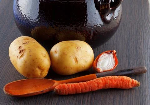 Vegetables and pot Stock Photos