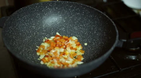Vegetables are fried in the frying pan Stock Footage 59699698
