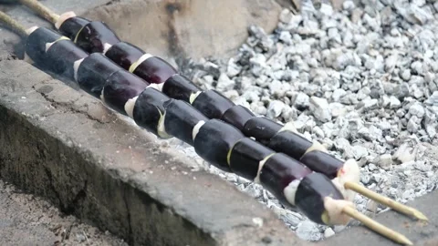 Vegetables are placed on the fire to cook-1 Stock Footage 293951057