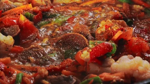 Vegetables are stewed in meat broth in spices and bubble on the fire 库存影片 288241731