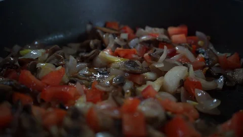 Vegetables are stewed in a pan Stock Footage 128307469