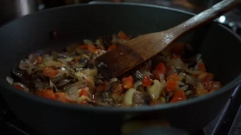 Vegetables are stewed in a pan Stock Footage 128307493