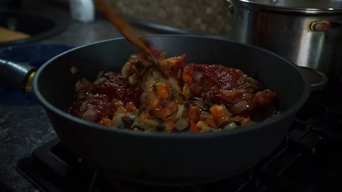 Vegetables are stewed in a pan Stock Footage 128307527