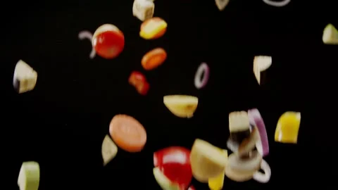 Vegetables are thrown into the frame, shooting video from hands Vídeo Stock 327571532