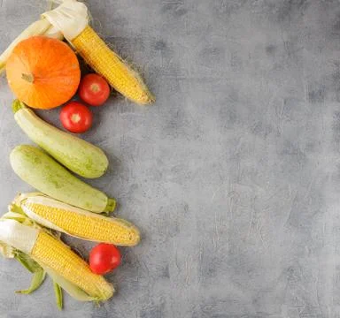 Vegetables background corn, tomatoes, zucchini Stock Photos