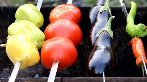 Vegetables being cooked on a BBQ Stock Footage 77861848