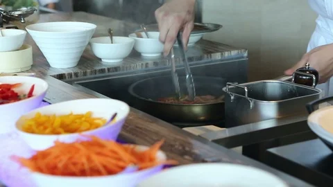 Vegetables being cooked in a frying pan 1 Stock Footage 126955319