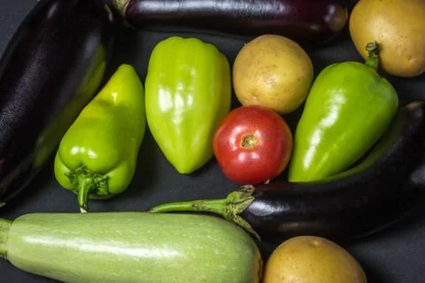 Vegetables on a black background.  Stock Photos