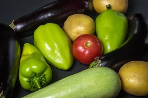 Vegetables on a black background.  Stock Photos