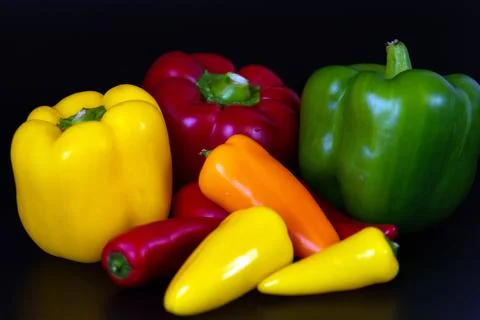 Vegetables on a black background. Stock Photos