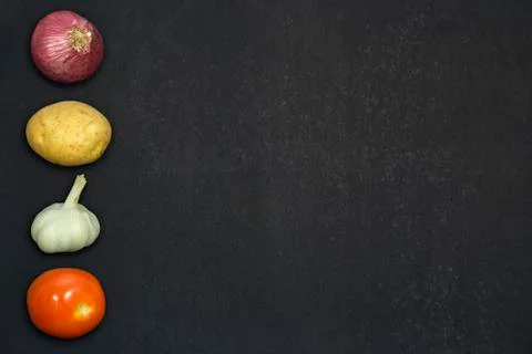 Vegetables on a black background template Stock Photos