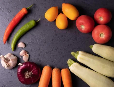 Vegetables on black stone surface Stock-Fotos