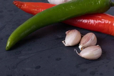 Vegetables on black stone surface Stock-Fotos