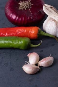 Vegetables on black stone surface Foto stock