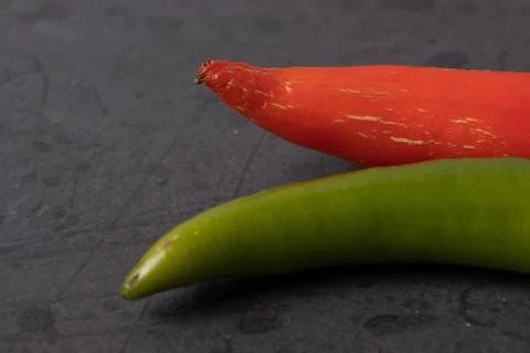 Vegetables on black stone surface Stock Photos