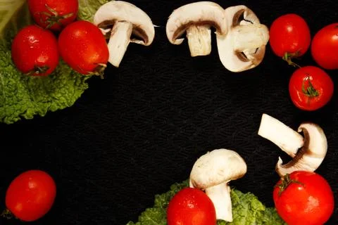Vegetables on a black surface, top view Stock Photos