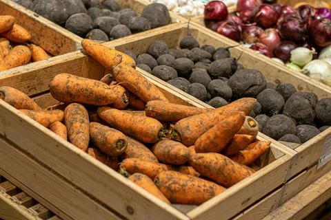 Vegetables in boxes in stores Stock Photos