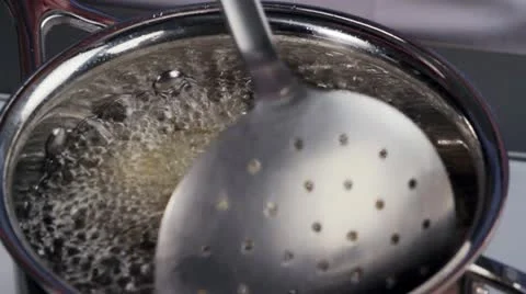 Vegetables in chickpea batter being fried Stock Footage 24672031