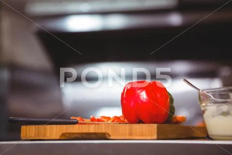 Vegetables On Chopping Board In A Commercial Kitchen