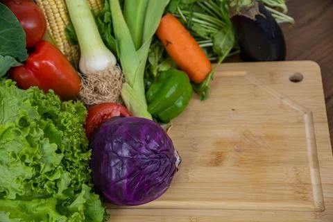 Vegetables on a chopping board. Stock Photos