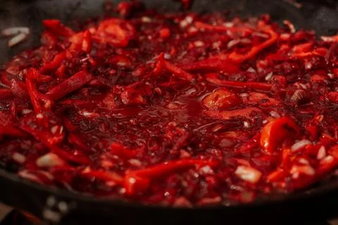 Vegetables cooked on a grill pan over an open fire in the woods. Cooking Stock Photos
