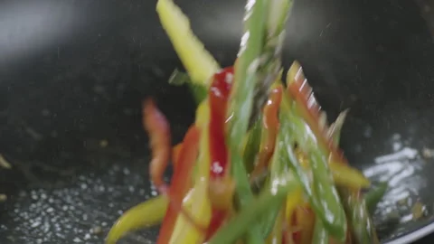Vegetables cooked in pan slowmotion Stock Footage 151274527