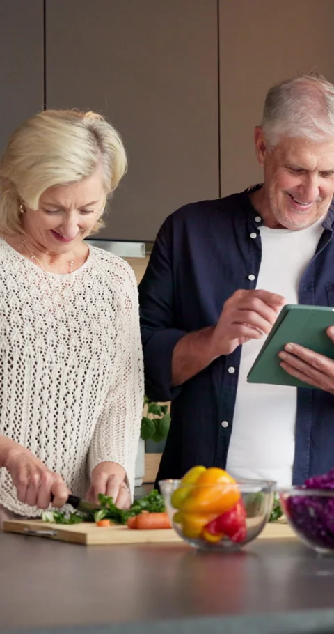 Vegetables, cooking and old couple with tablet, chopping board or laugh with Stock Footage 336855679