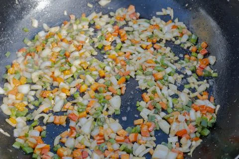 Vegetables cooking in a pan Stock Photos