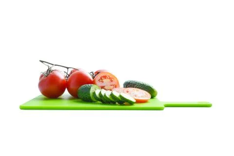 Vegetables on cut board white background Foto stock