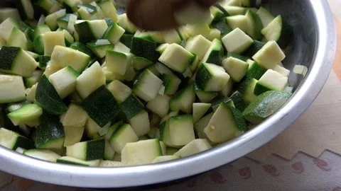 Vegetables cut in cubes fried on frying pan, in kitchen. Stock Footage 130837618
