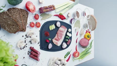 Vegetables on cutting board surrounded by ingredients Stock Footage 231221190