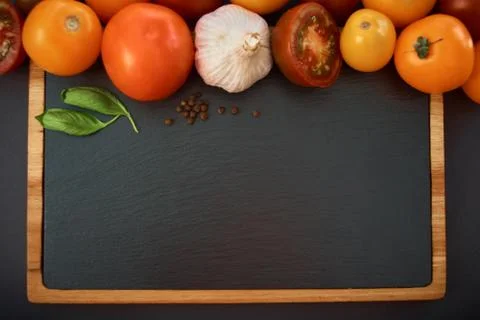 Vegetables dark background with copy space. Healthy meal. Menu, price backgro Stock Photos