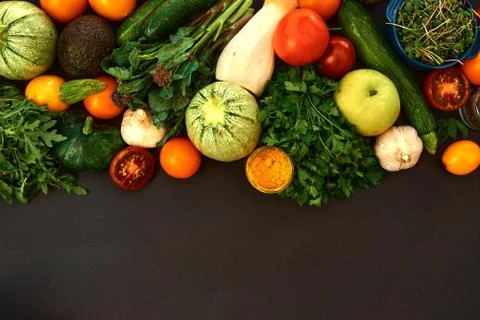 Vegetables dark background with copy space. Healthy meal. Menu, price backgro Stock Photos