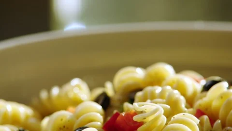 Vegetables fall over rotini ECU Video stock 120756346