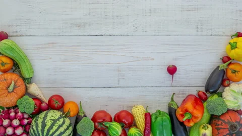 Vegetables fall on white wooden background, stop motion animation, 4K Stock Footage 141248896