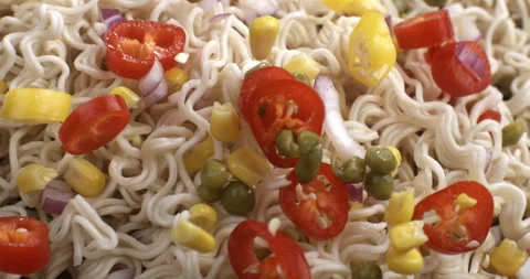 Vegetables falling in pan with asian noodles to be cooked in restaurant kitchen Stock-Footage 268802459